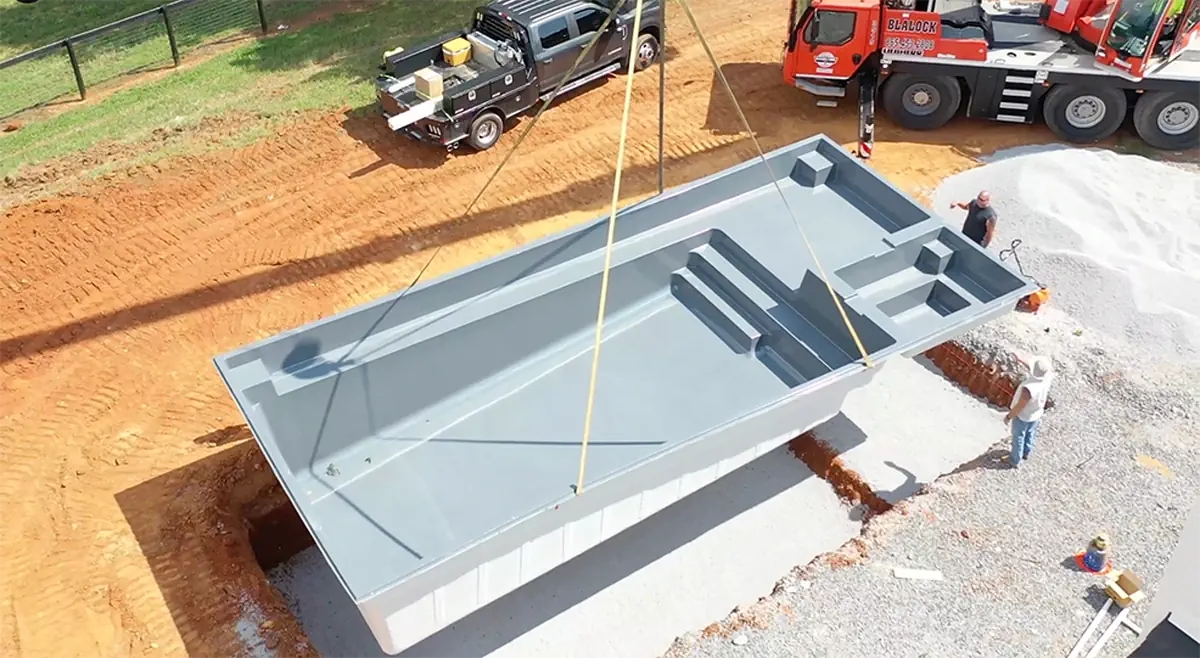 Reap benefits by building a backyard pool at the same time you build a new home. 